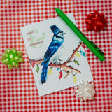 Blue Jay with Christmas Lights that says "Peace & Joy & Happiness." Holiday Christmas Greeting Cards for Christian Women.