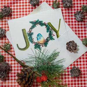 Watercolor Christmas Wreath with a small blue bird and the word JOY. Holiday Greeting Cards for Christian Women.